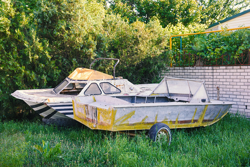 Two old abandoned boats in the yard, outdoor